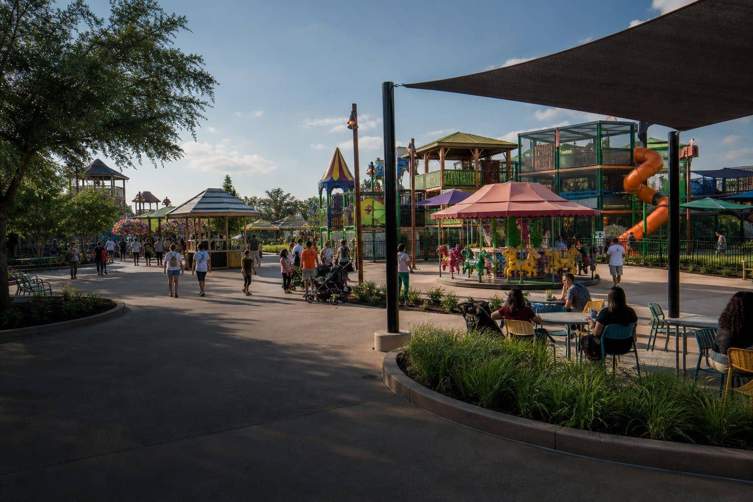 An outdoor family entertainment park with play areas and shaded seating